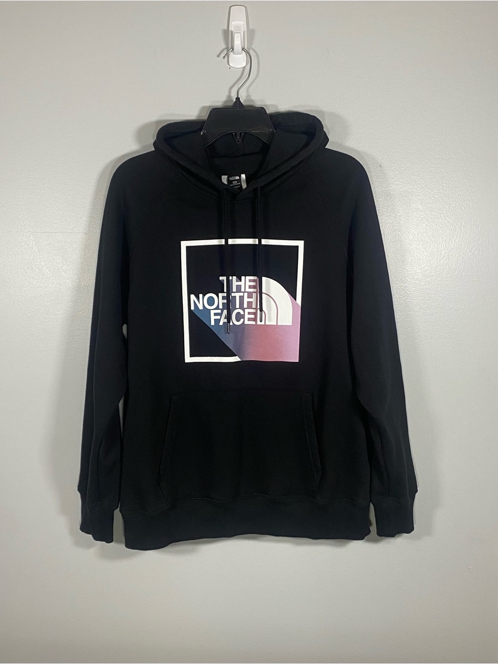 The North Face Black Pullover Hoodie with Blue-to-Pink Logo